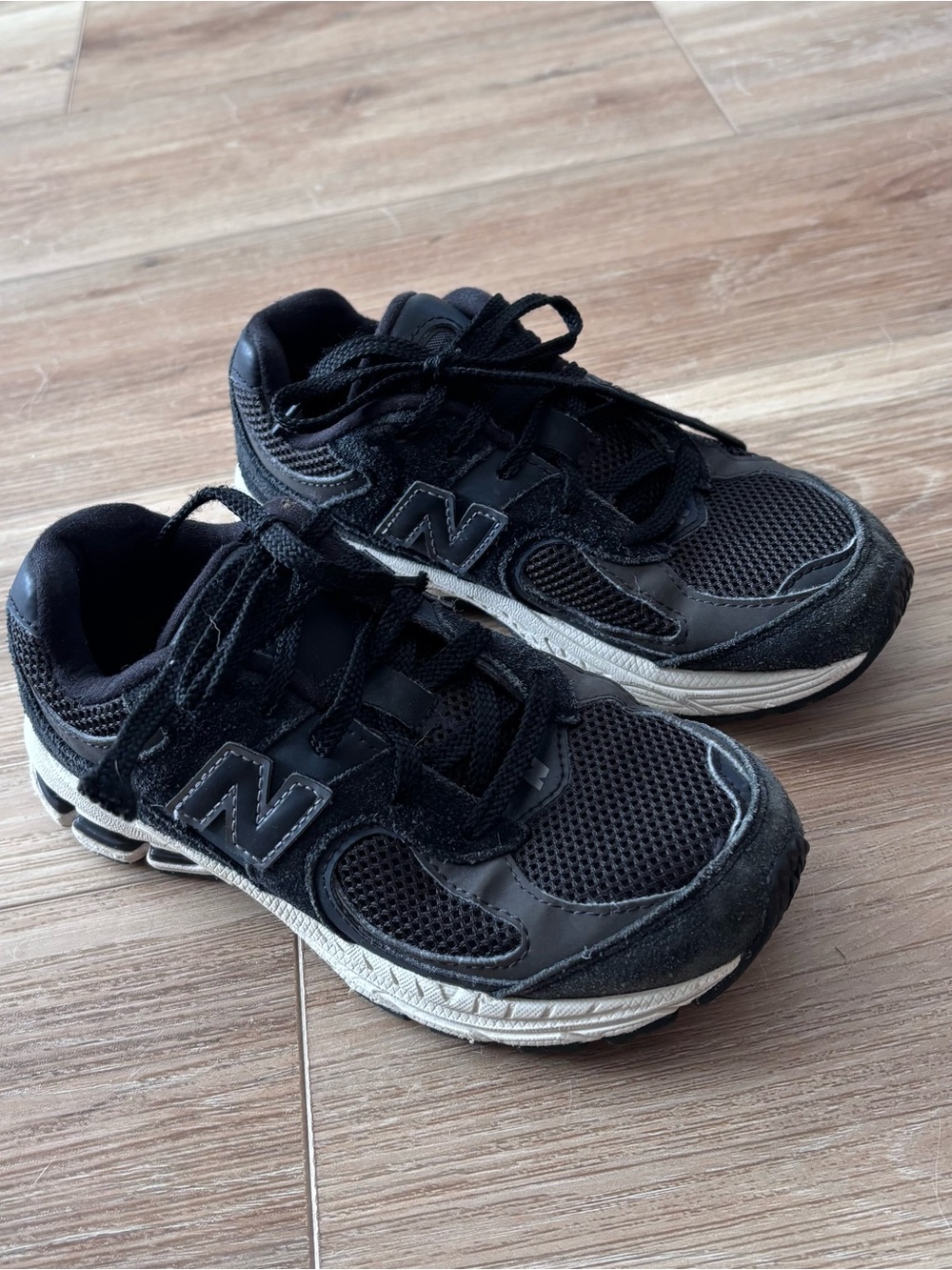 New Balance 2002r Black and White Sneakers size 1 see photos for wear unisex